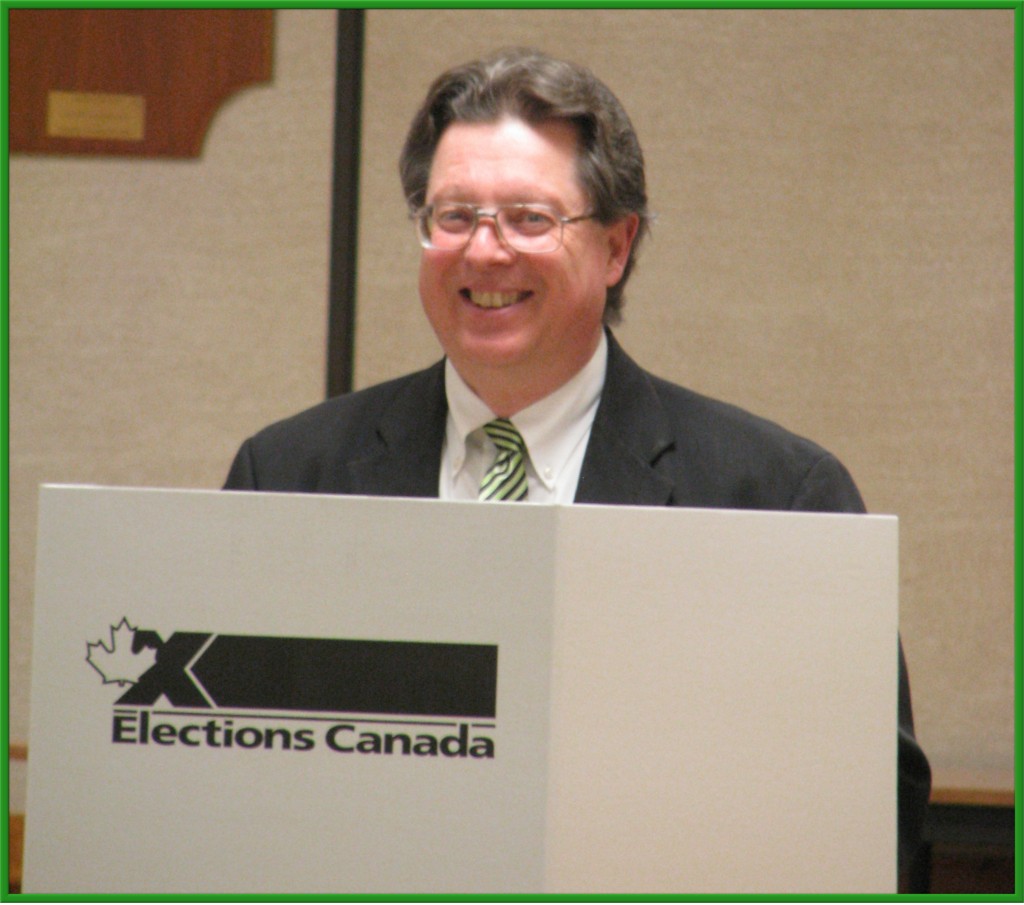 Bob Jonkman smiling behind voting screen