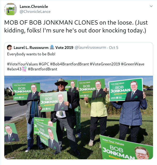 @ChronicleLance tweeted "MOB OF BOB JONKMAN CLONES on the loose. (Just kidding, folks! I'm sure he's out door knocking today.)" on a Retweet of a signwaving photo where everyone holds Bob's sign face in front of their own faces.